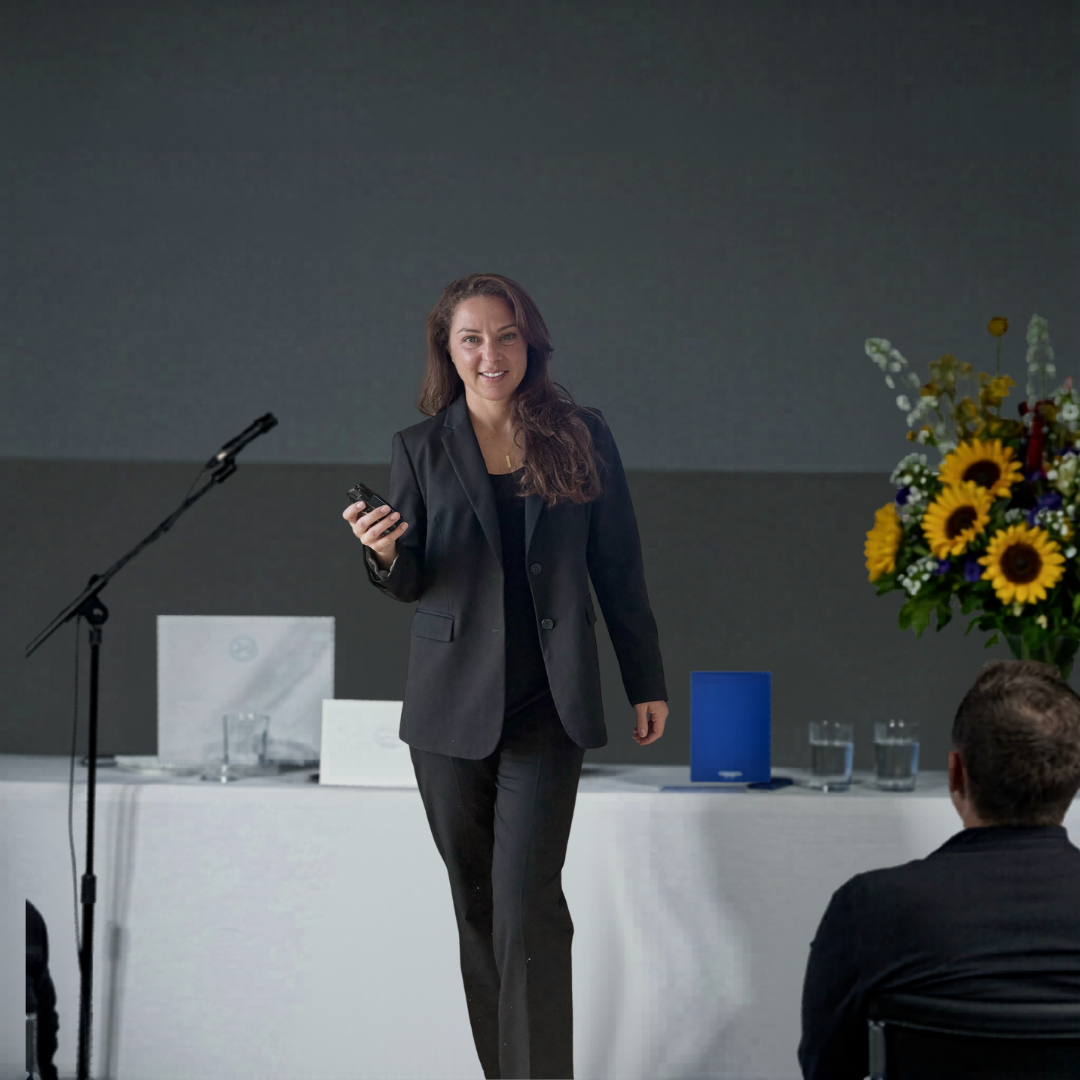 Jen Seregos speaking on stage